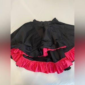 Black with fuchsia can can skirt. Child large pumpers costume.